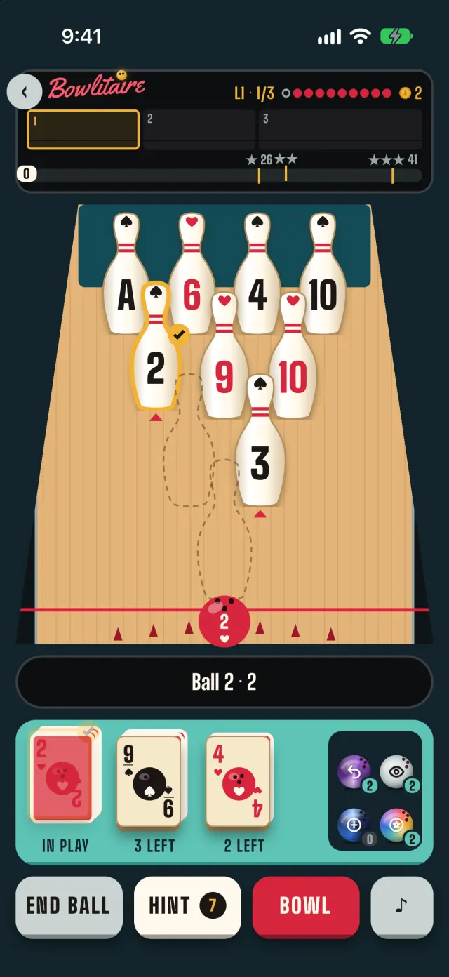 A Tour level in the app: ten pins on the lane, a 2 of hearts ball card in play, the 2 pin picked, and the hint bar reading Ball 2 · 2.
